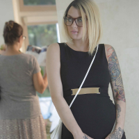 Glasses wearing tattooed blonde Emma Mae exposing large all natural tits