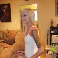 Blonde teen babe Emma Mae shows her melons and her juicy twat