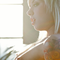 Gorgeous slender tattooed babe Emma Mae posing in nude erotica