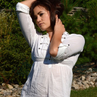 Tess Lyndon touches herself outside in a white top