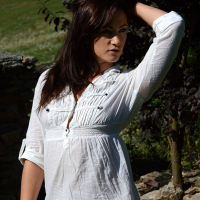 Tess Lyndon touches herself outside in a white top
