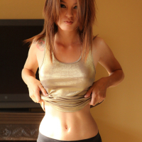 Ashley Doll in tight black yoga pants stripping nude
