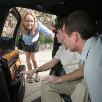 Chippy teen chick serving two boners with her mouth on the back seat