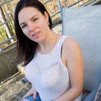 Playful Talia Amanda shows her large jugs outside