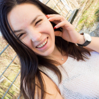 Playful Talia Amanda shows her large jugs outside