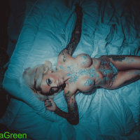Tattooed blonde girl Kayla Green unveils her big round tits