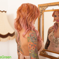 Lovely girl Kayla Green teasing with her tattooed body