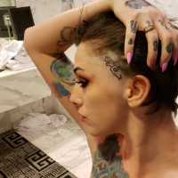 Tattooed hottie Sully Savage sucks off a big cock