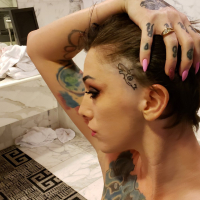 Tattooed hottie Sully Savage sucks off a big cock