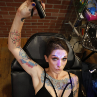 Kinky chick Sully Savage exposes her tattooed cunt