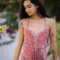 Erotic model Dulce Rivera drops her summer dress to reveal her pink pussy