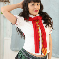 Foxy brunette Sophia Jade lifts her miniskirt to tease with her ass