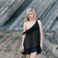 Erotic Babe Anna Tatu posing naked on some Rocks