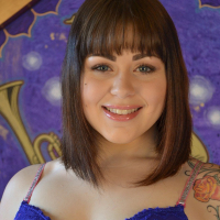 Sarah Greenmore in blue lingerie toys her cunt