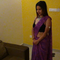 Lovely Indian babe Tina showing her nice body in a sexy outfit