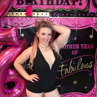 Curvy Emmy Demure posing in a pink bikini on the boat