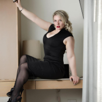 Sensual Emmy Demure in Black Stockings and Bra