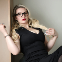 Sensual Emmy Demure in Black Stockings and Bra
