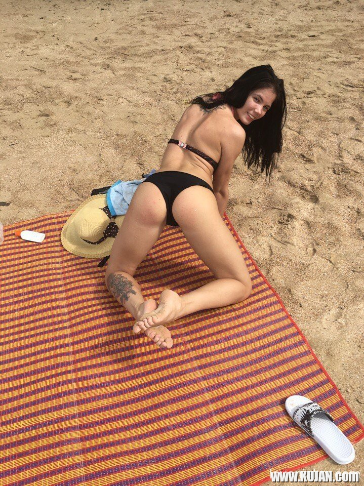 Gorgeous girl Lovenia Lux posing in a black bikini on the beach - Photo #3174850