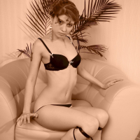 Redhead beauty Donna showing her small tits and shaved pussy