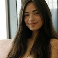 Round tits model Scarlett Alexis smiling while taking off her black panties