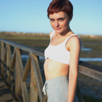 Naughty short haired girl Caterina Foxy revealing her tiny naked tits