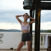 Naughty short haired girl Caterina Foxy revealing her tiny naked tits