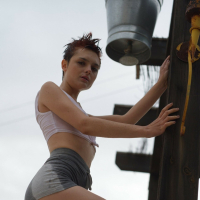 Naughty short haired girl Caterina Foxy revealing her tiny naked tits
