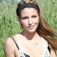 Cute Shiny Lola drops down her Pantyhose Outdoors