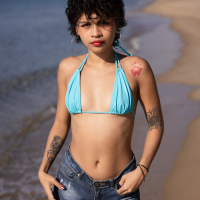 Good looking Lilith Baph with natural tits hot as posing naked on a beach