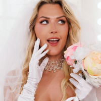 Sexy bride Savvy Suxx does not mind showing her shaved pussy