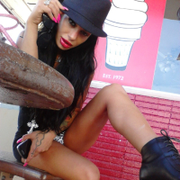 Angelina Valentine teasing with her red lips and pink nails