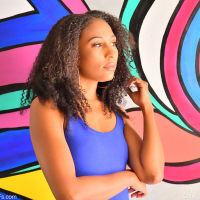 Ebony Olivia Jayy lifts up her tight blue dress