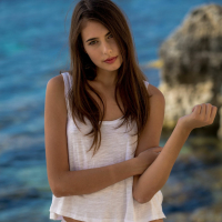 Awesome brunette model Katrine Pirs shows off her naked curves on rocks