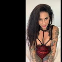 Horny tattooed babe Joanna Angel plays with a big black dildo