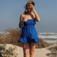 Solo Ellie Nova with big natural tits showing off her butt on the beach