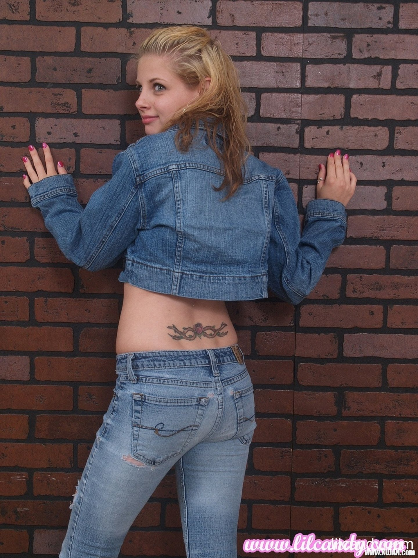 Petite teen Lil Candy strips her jean jacket to reveal her small tits - Photo #3234156