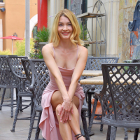 Gorgeous blonde Anikim Jones flashing her shaved pussy in public