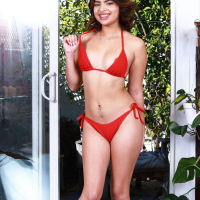 Solo model Hazel Heart removes her red bikini to show her hairy pussy
