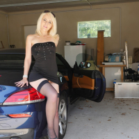 Ashlee Cox poses with her Tits out by a Supercar