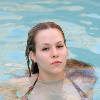 Blonde Fiona Luv with hot ass posing naked outdoors by the pool