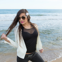 Gorgeous Clara Sweet showing her nice tits in a bra on the beach