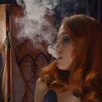 Luna Lain smoking and toying her shaved Pussy