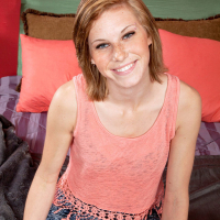 Amateur solo model Ella Woods getting completely naked on the bed