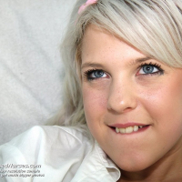 Horny blonde nurse Kristina Rud pumps up her twat with a slick dildo