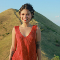 Amateur model Lilith Baph drops her red dress during a hike