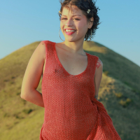Amateur model Lilith Baph drops her red dress during a hike
