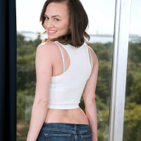 Brunette hottie Alex More drops down denim shorts before fingering her cunt