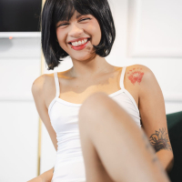 Tattooed amateur Lilith Baph undressing and spreading legs on the chair