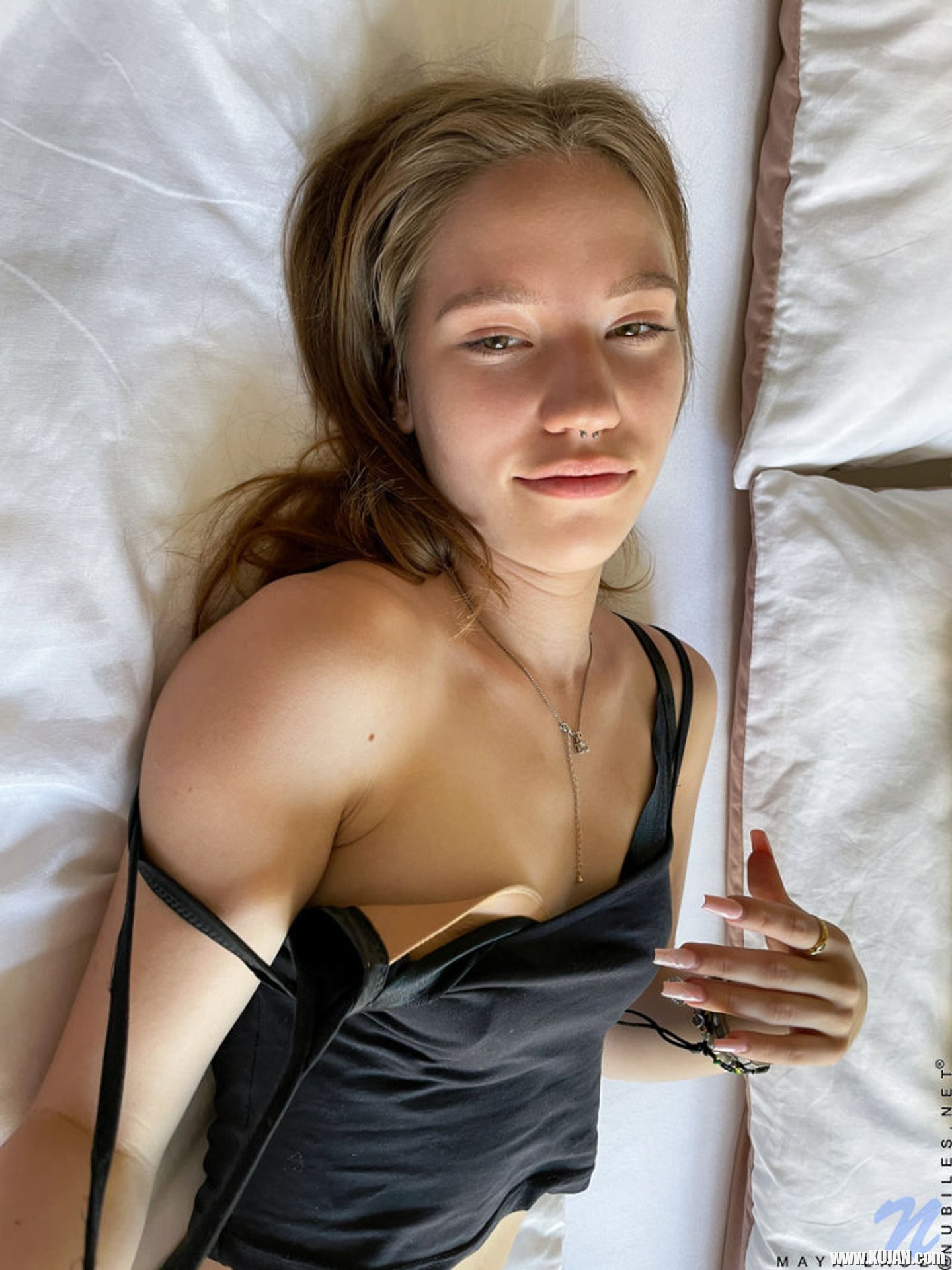 Solo Maya Sinn gently fingering her shaved pussy on the bed - Photo #3299855